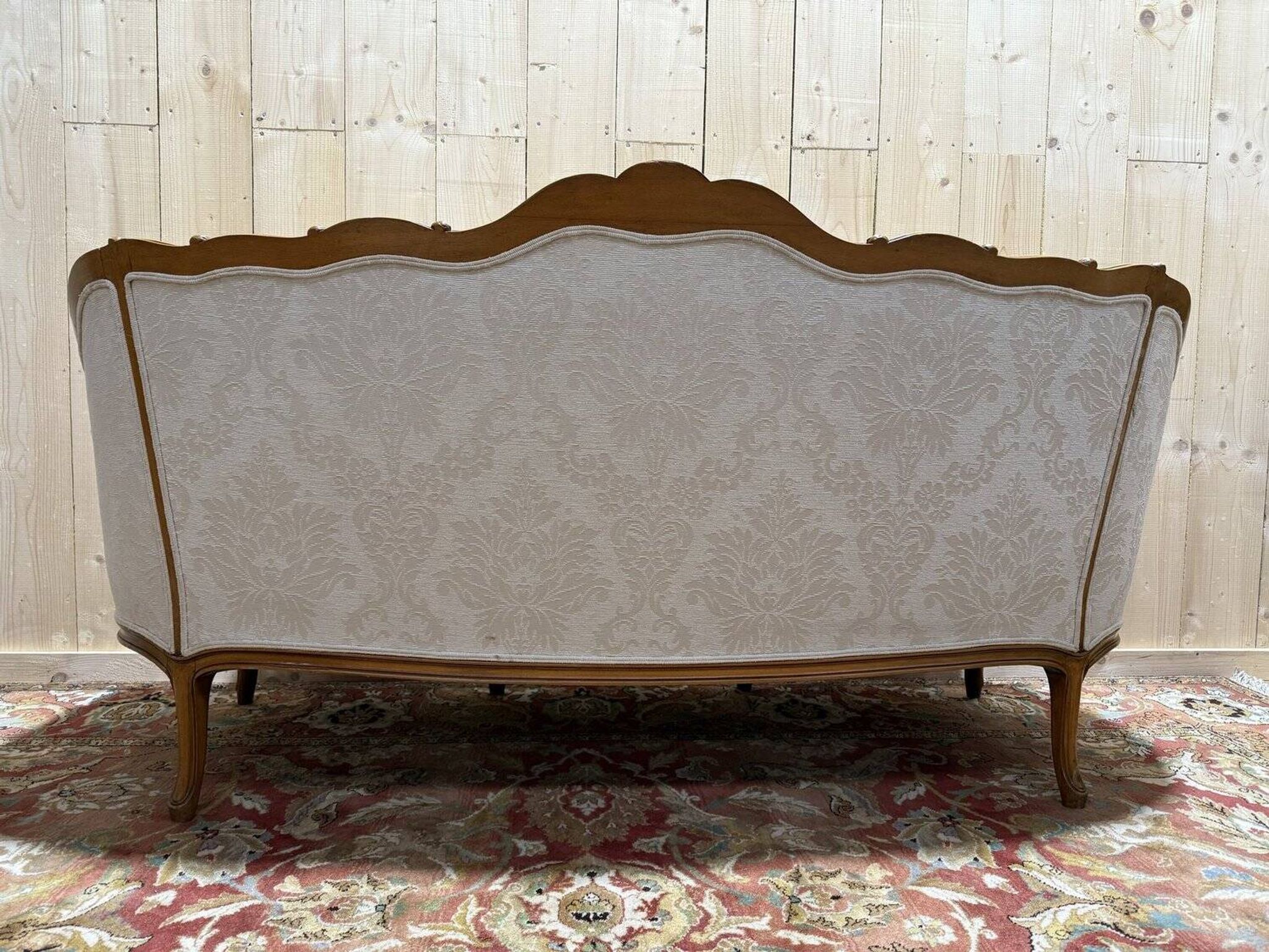 Beige Louis XV style salon sofa and pair of armchairs.