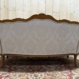 Beige Louis XV style salon sofa and pair of armchairs.