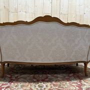 Beige Louis XV style salon sofa and pair of armchairs.