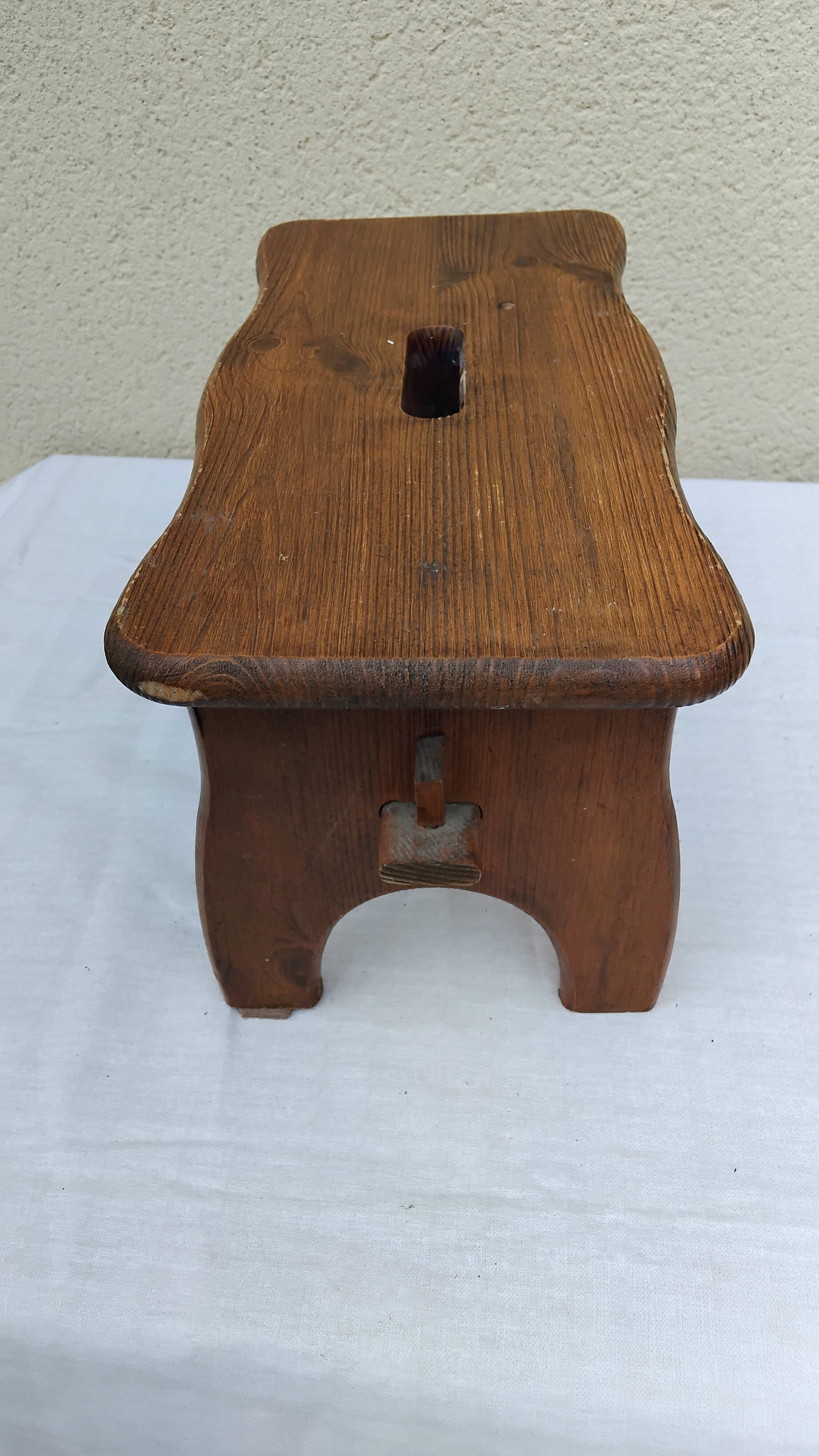 Old small vintage farm stool