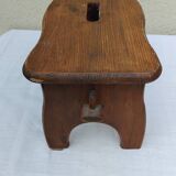 Old small vintage farm stool