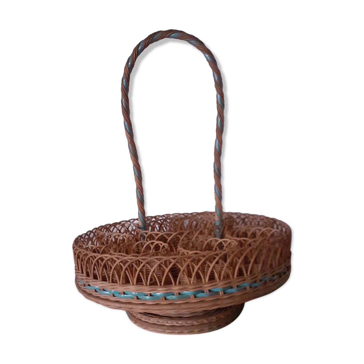 Glass holder and wicker bottle with green plastic water surface