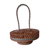 Glass holder and wicker bottle with green plastic water surface