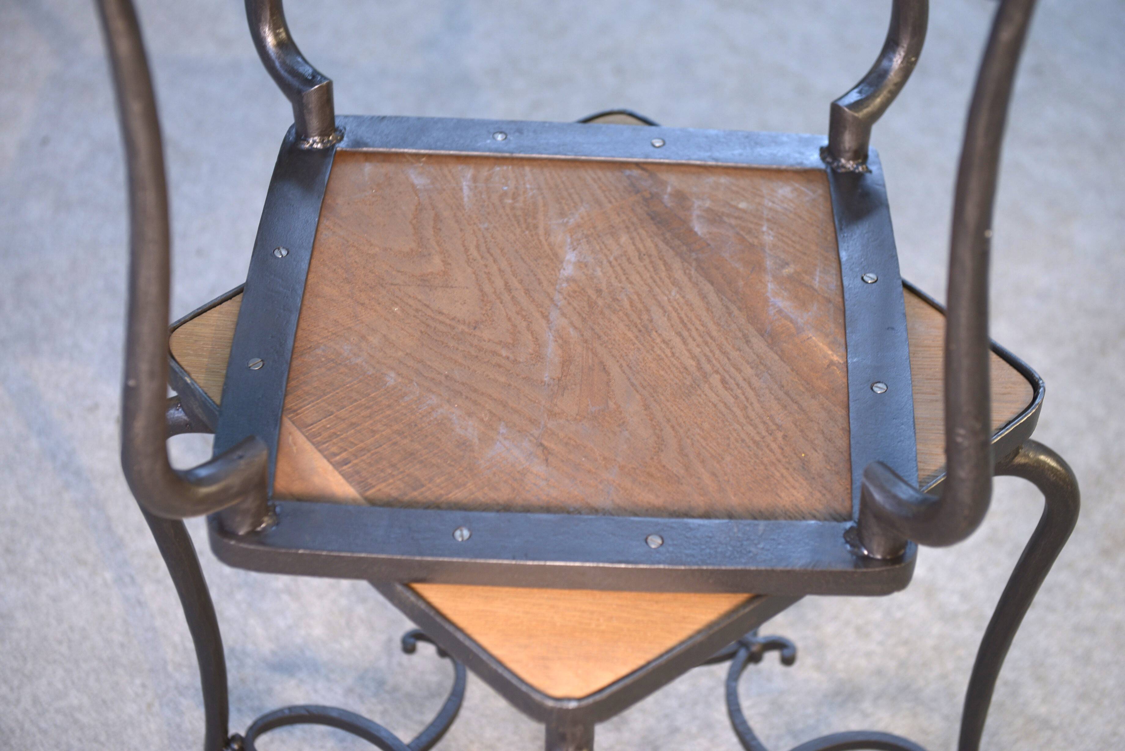 Pair of wrought iron side tables with oak tops, French work
