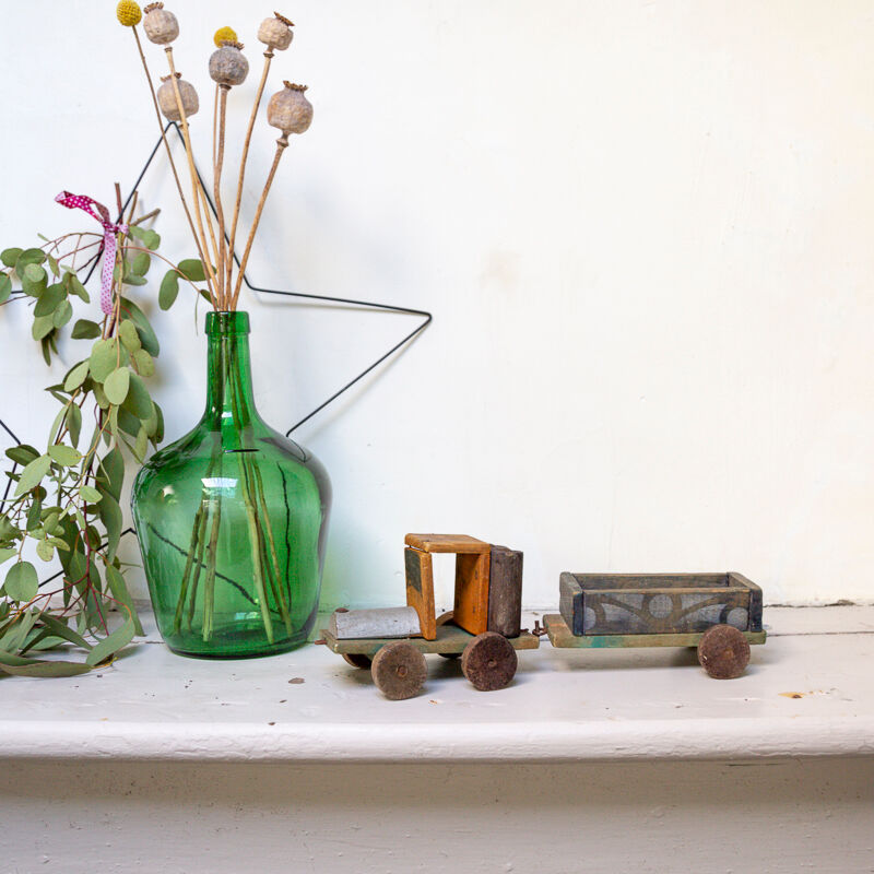 Old wooden train locomotive and toy trailer