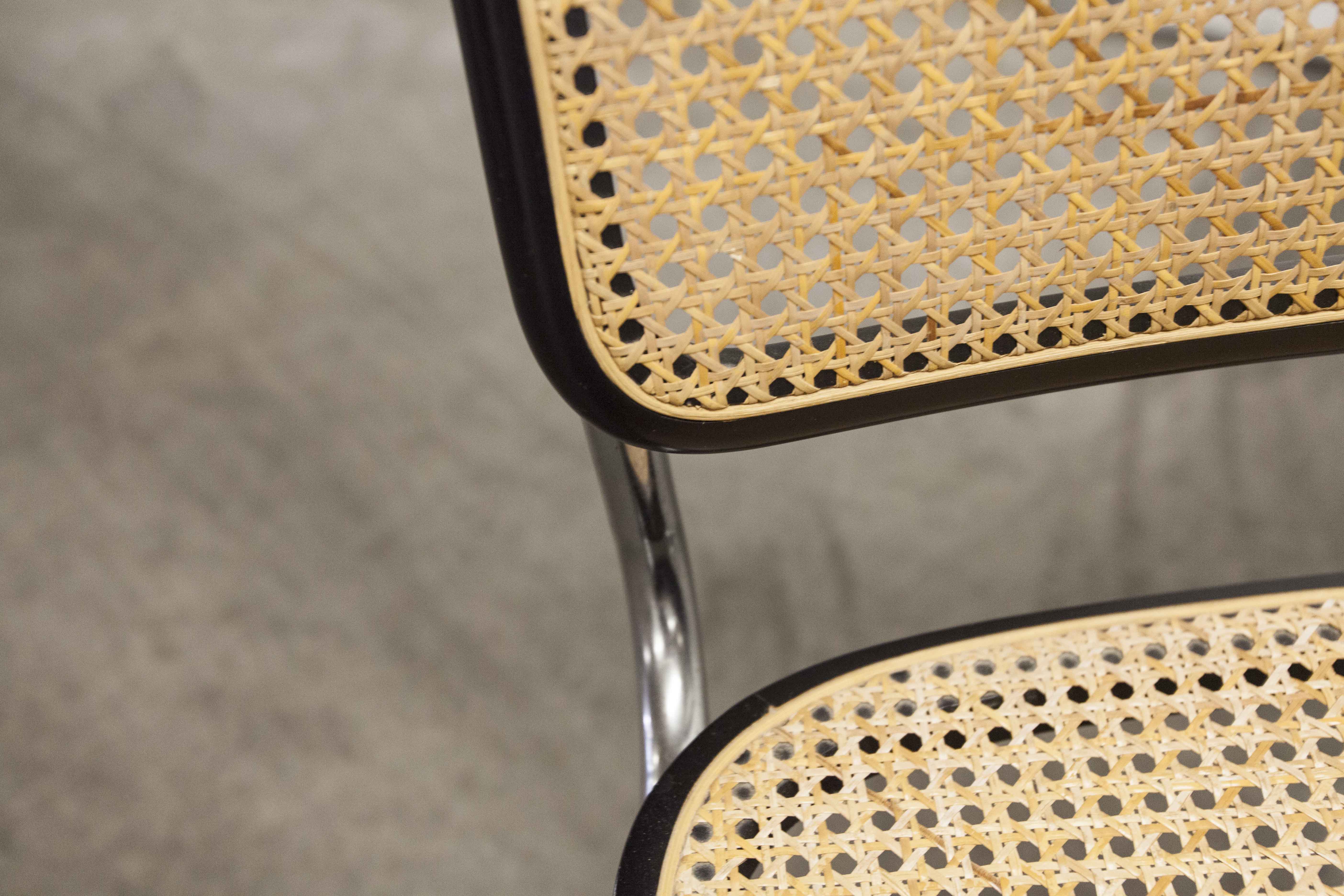 Pair of black Breuer b32 chairs and cannage