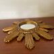 Vintage sun mirror in 60s/70s gold resin