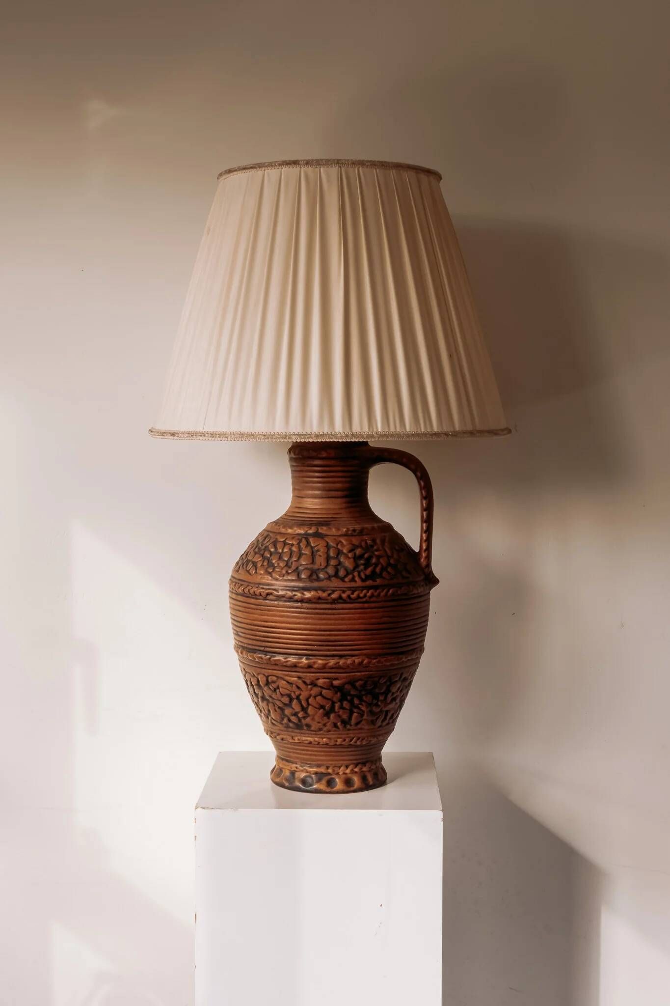 Large ceramic table lamp from West Germany with a pleated shade.