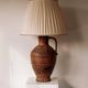 Large ceramic table lamp from West Germany with a pleated shade.