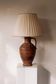 Large ceramic table lamp from West Germany with a pleated shade.