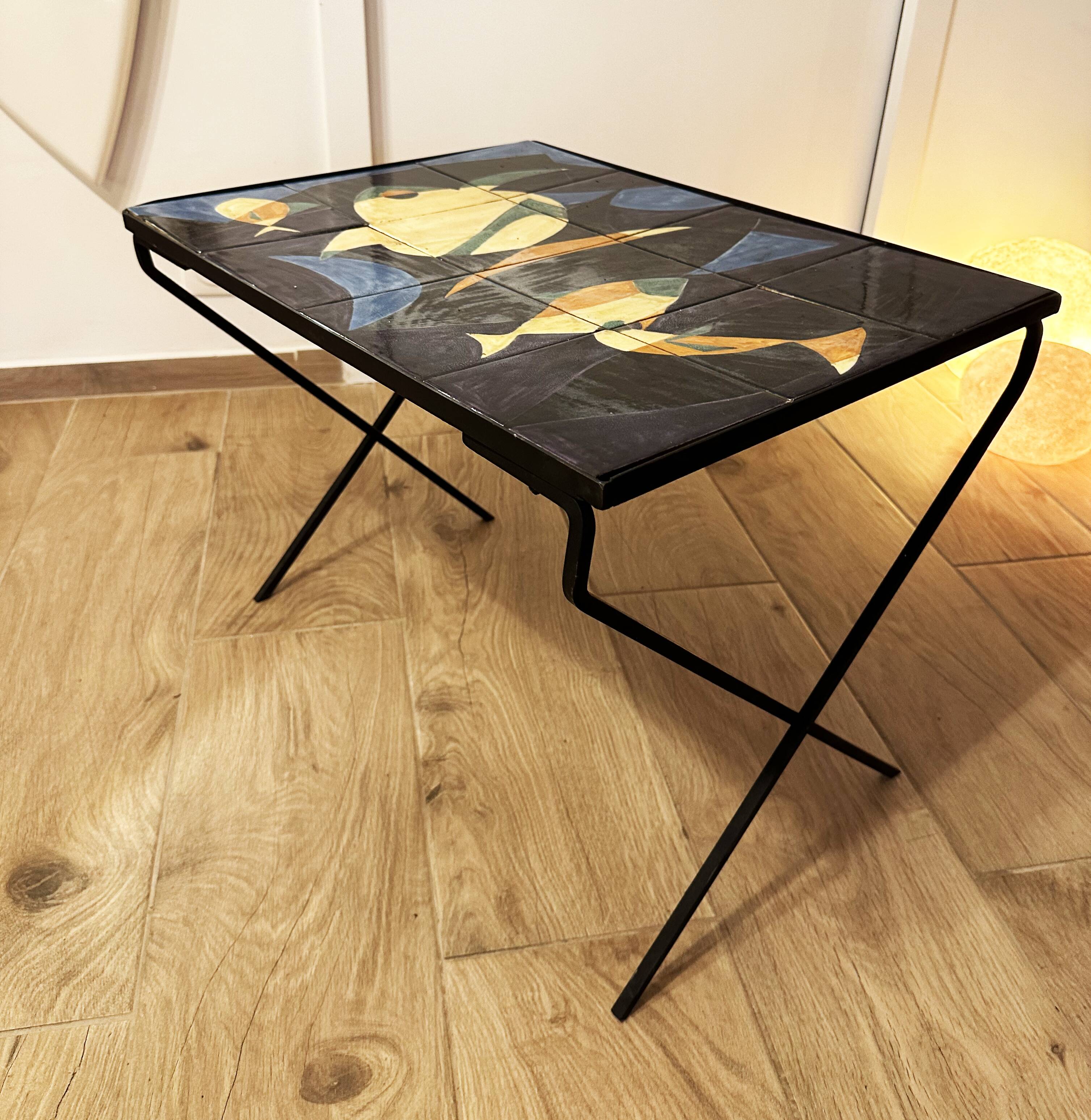 Coffee table with hand-painted ceramic top. France, 1950s