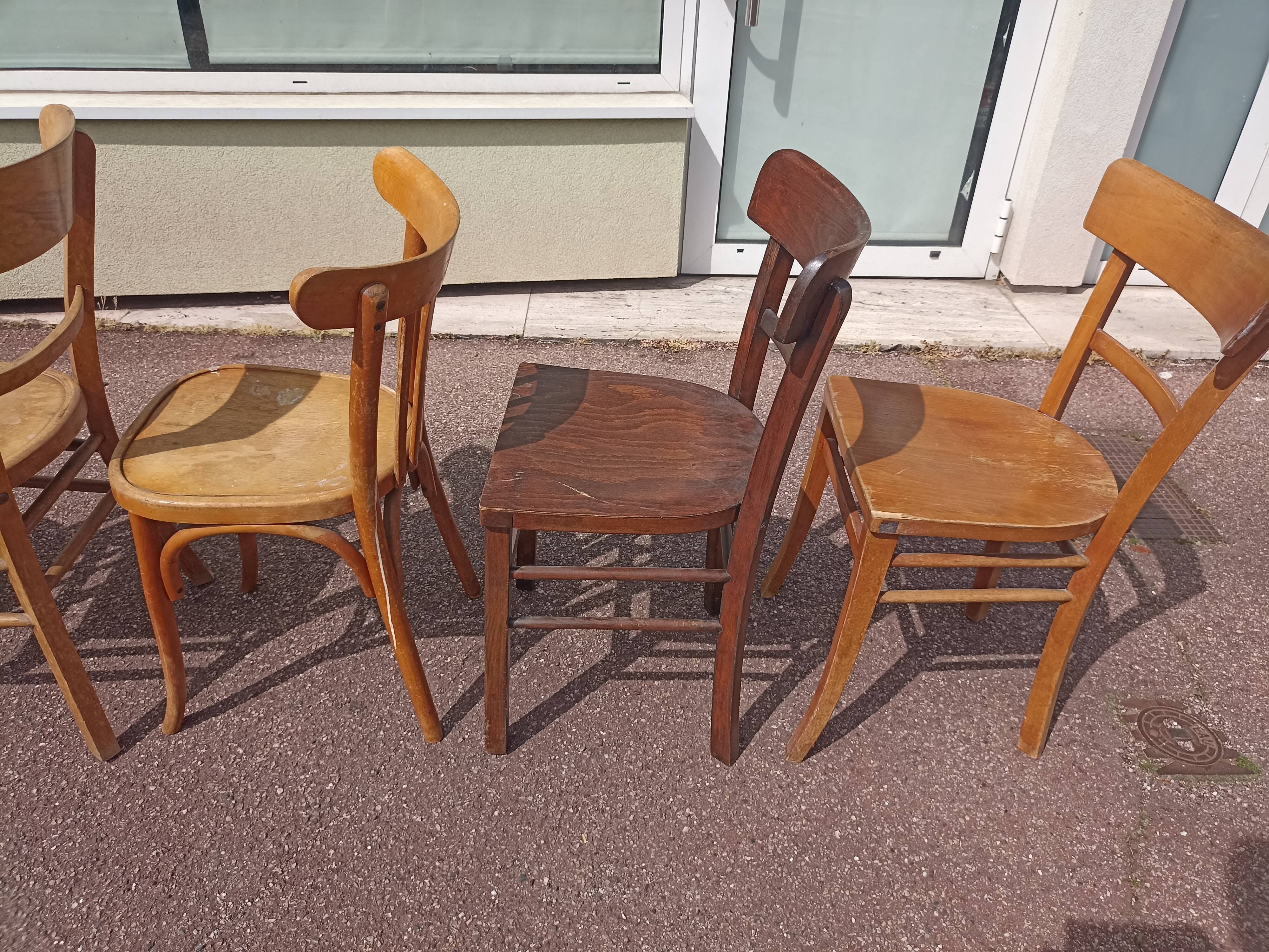 Set of 12 mismatched wooden bistro chairs
