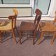 Set of 12 mismatched wooden bistro chairs