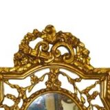 Oval gilded mirror