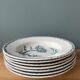 Set of 7 hollow plates Terre de Fer K.G Lunéville, model "carnation"