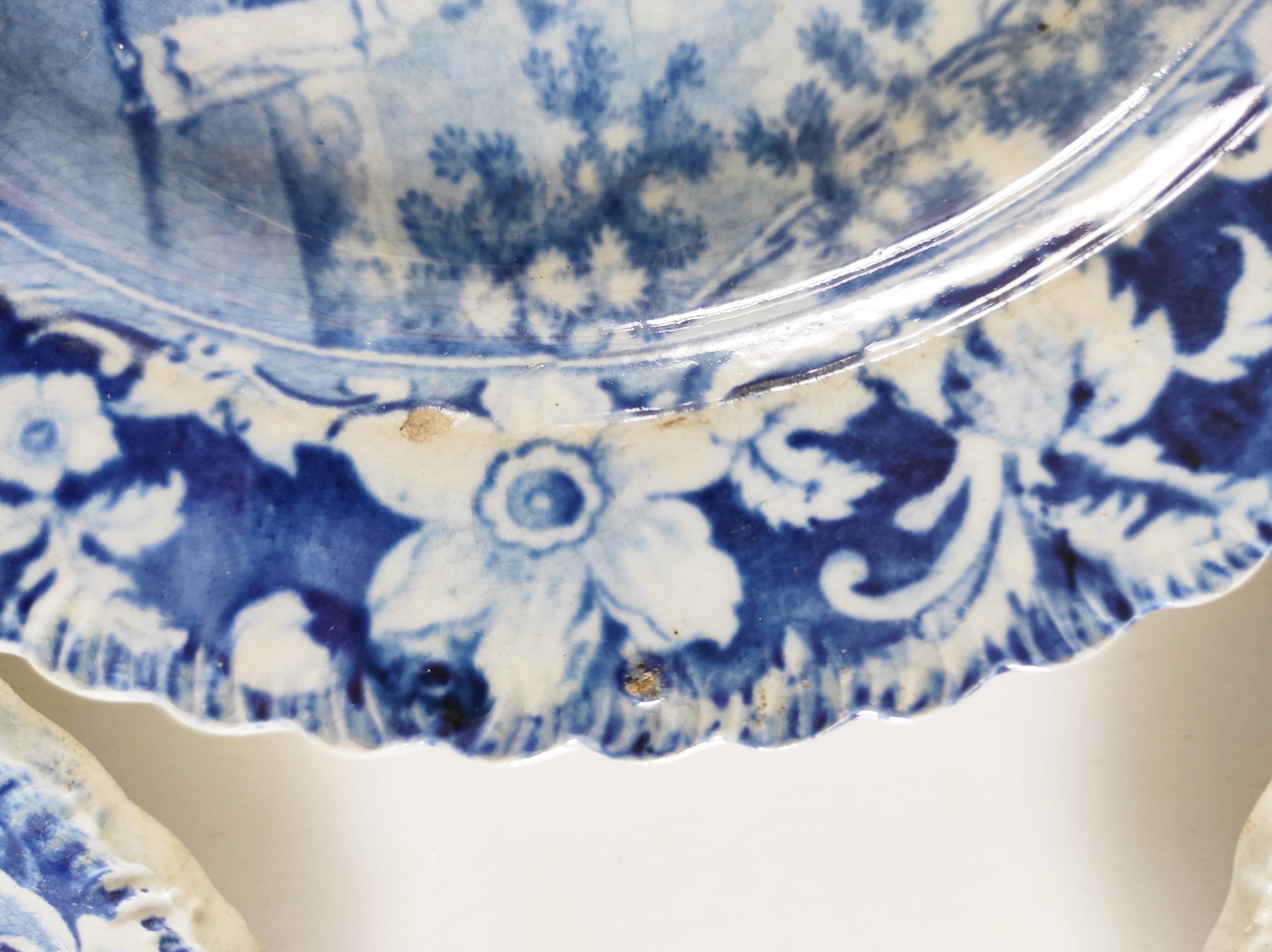 Five 19th century Calais earthenware plates with a romantic gallant couple decor