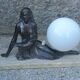 Art Deco lamp in cast iron and marble with a white opaline globe.