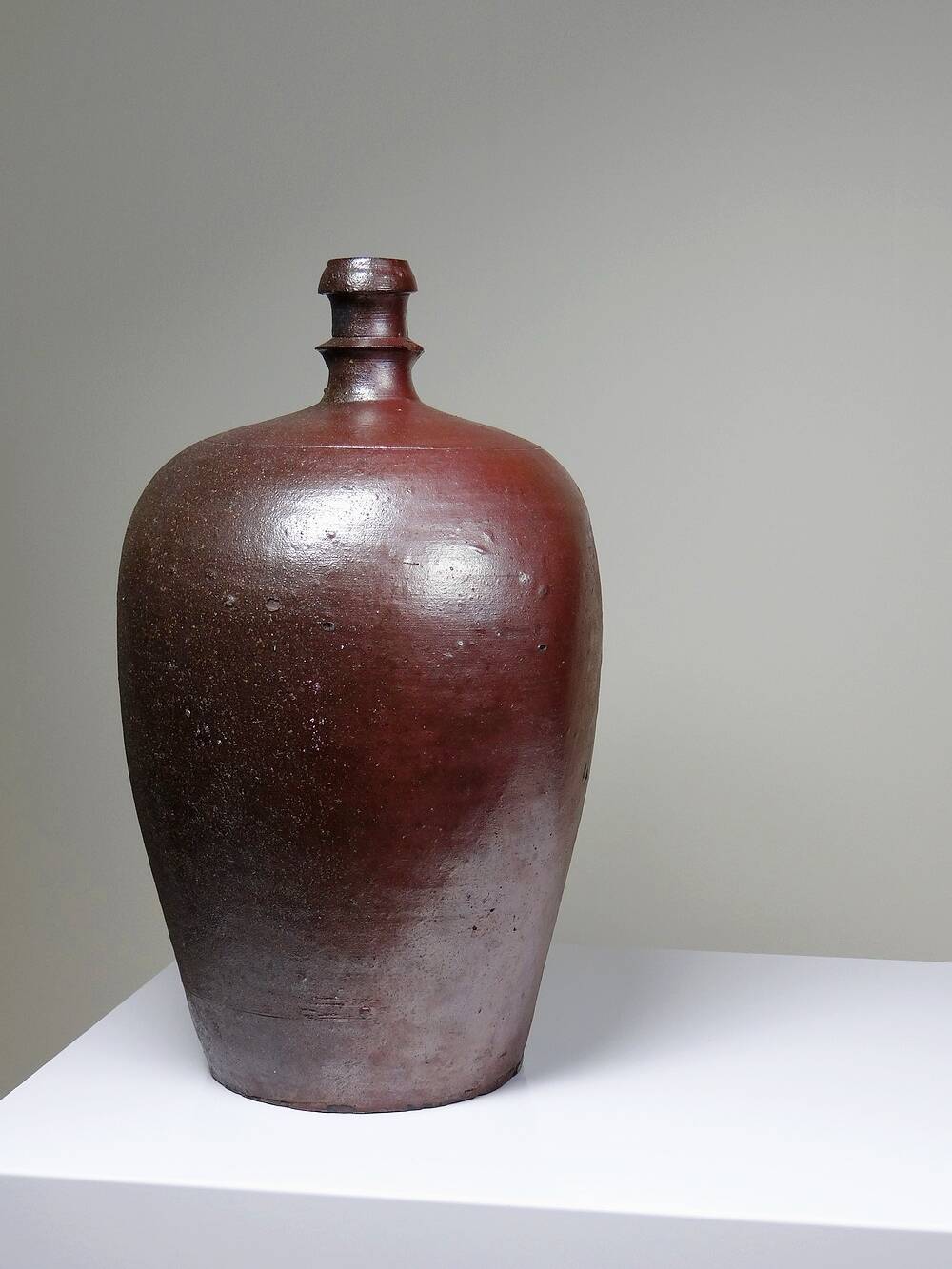 Large stoneware jar from Normandy with lustrous burgundy glaze, from the 1920s-30s.