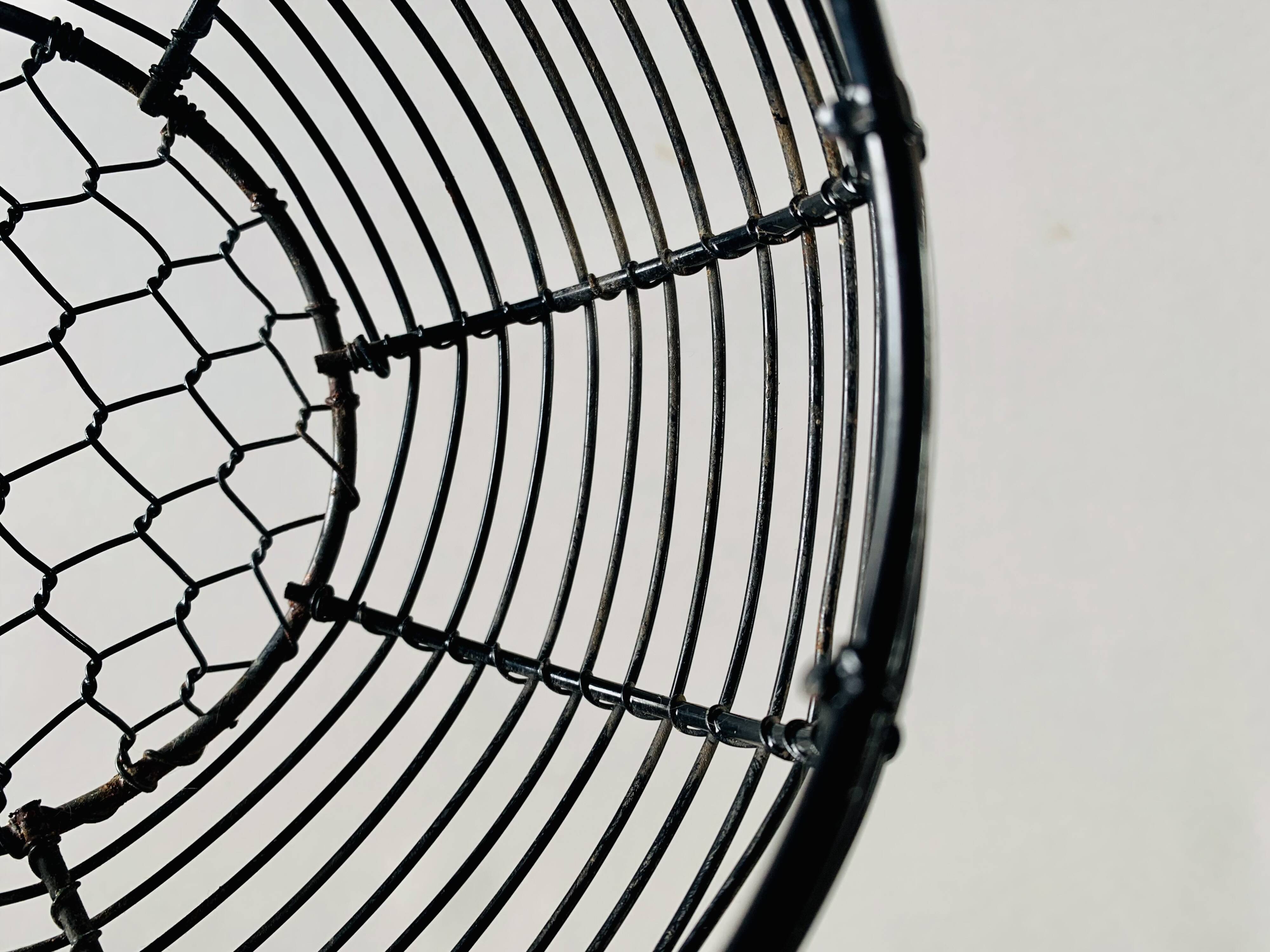 Vintage black metal egg basket