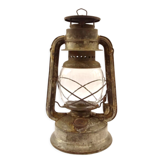 Old oil lantern in metal and glass