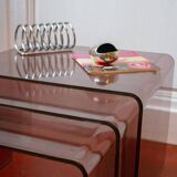 Vintage trio of nesting tables in smoked plexiglass by Michel Dumas, year.