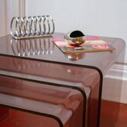 Vintage trio of nesting tables in smoked plexiglass by Michel Dumas, year.
