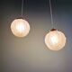 Pair of Art Deco pendant lights in pressed molded satin glass, 1920-30