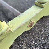 Old table with patinated green legs
