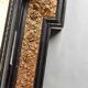 Antique wall mirror in blackened wood and gilded stucco, 19th-century Dutch style.