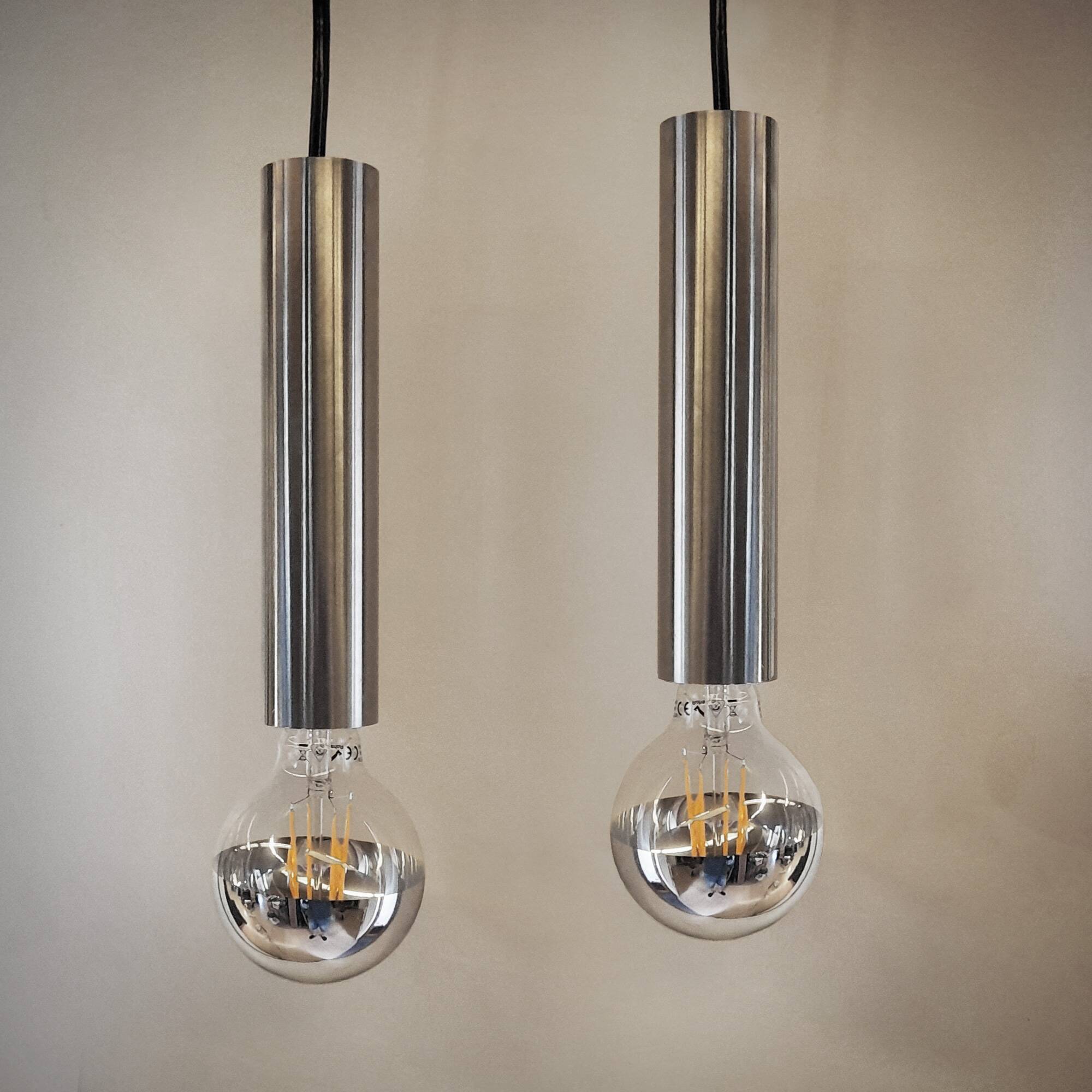 Pair of still tube pendant lights in polished stainless steel, 1970s, new