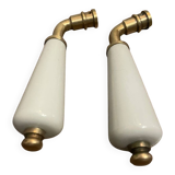pair of antique porcelain door handles with brass stems