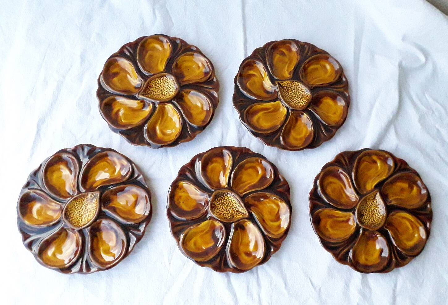5 oyster plates in slipware
