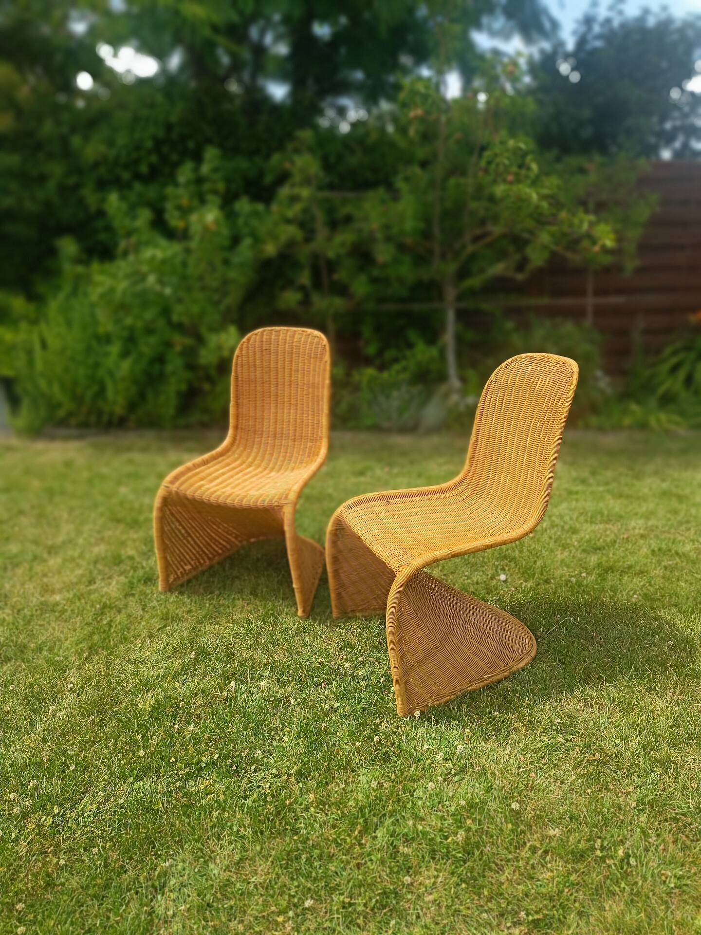Pair of rattan chairs in the style of Verner Panton