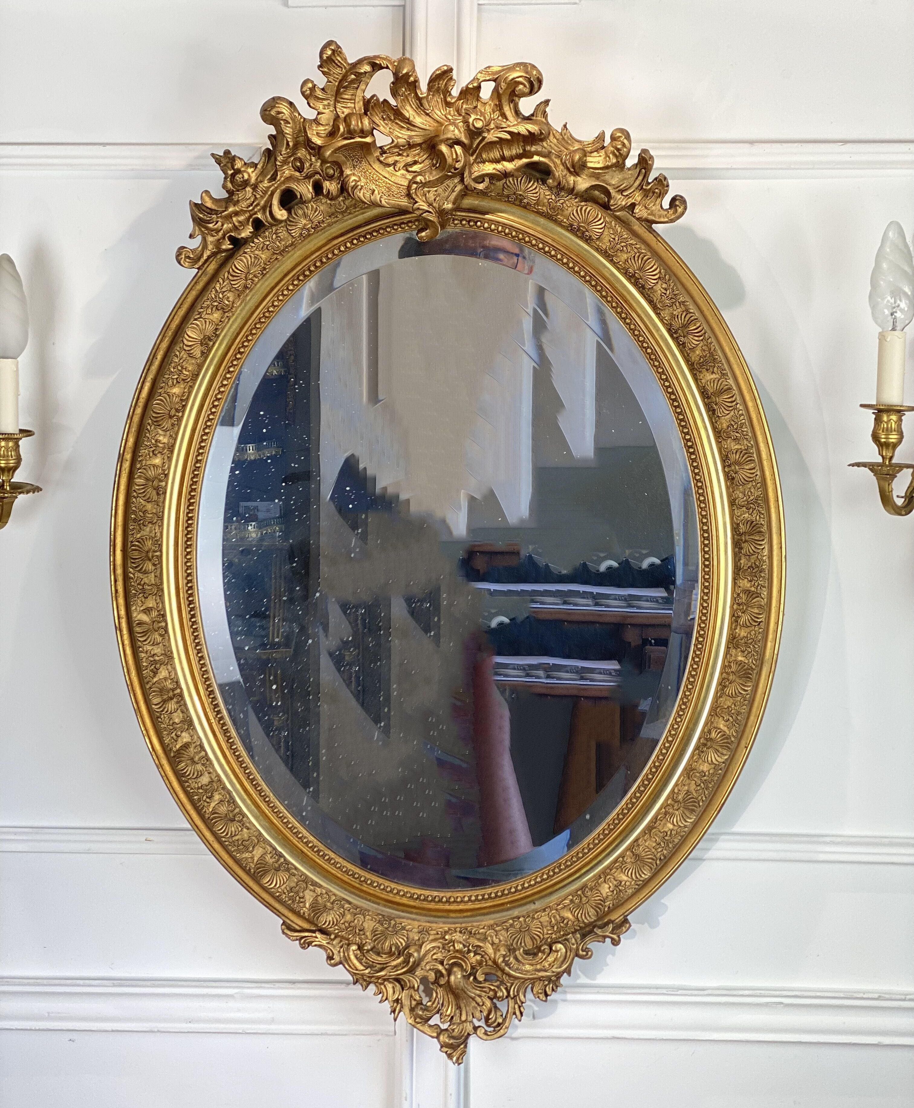 Mirror / oval ice Napoleon III period in wood and gilded stucco louis xv style