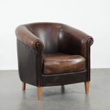 Characterful club armchair made of sheepskin with a beautiful patina