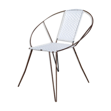 Vintage armchair in black metal and white plastic caning.