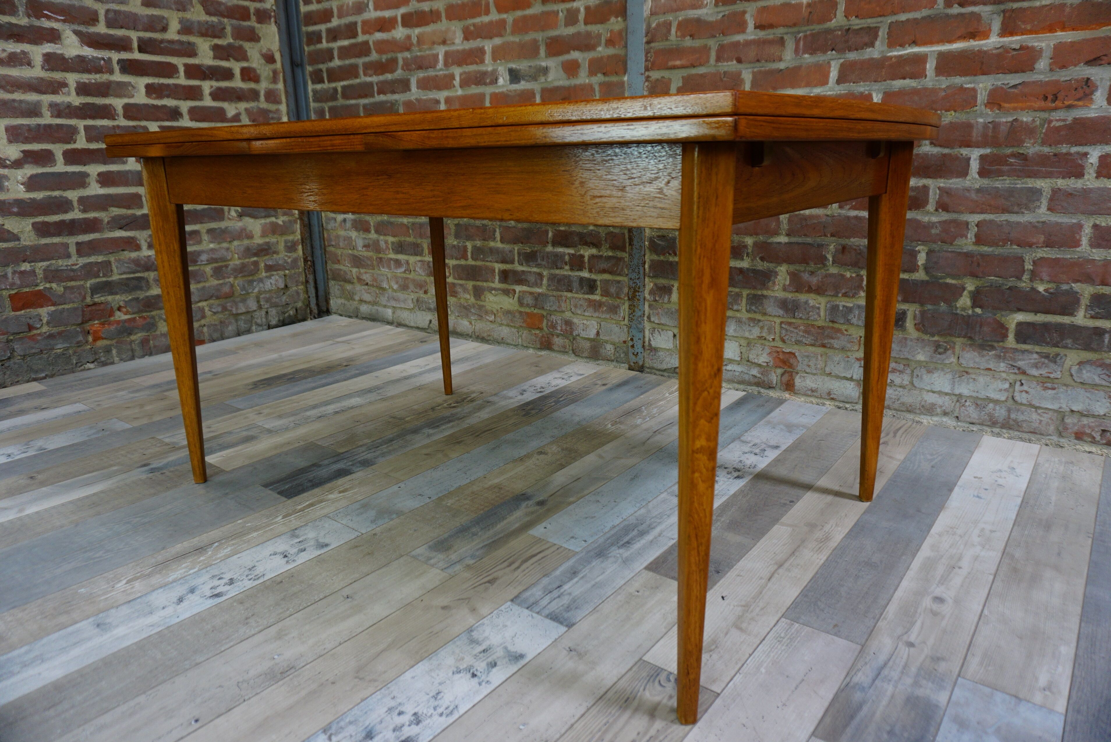 Teak dining table design by Johannes Andersen for Samcom 60s