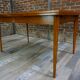 Teak dining table design by Johannes Andersen for Samcom 60s