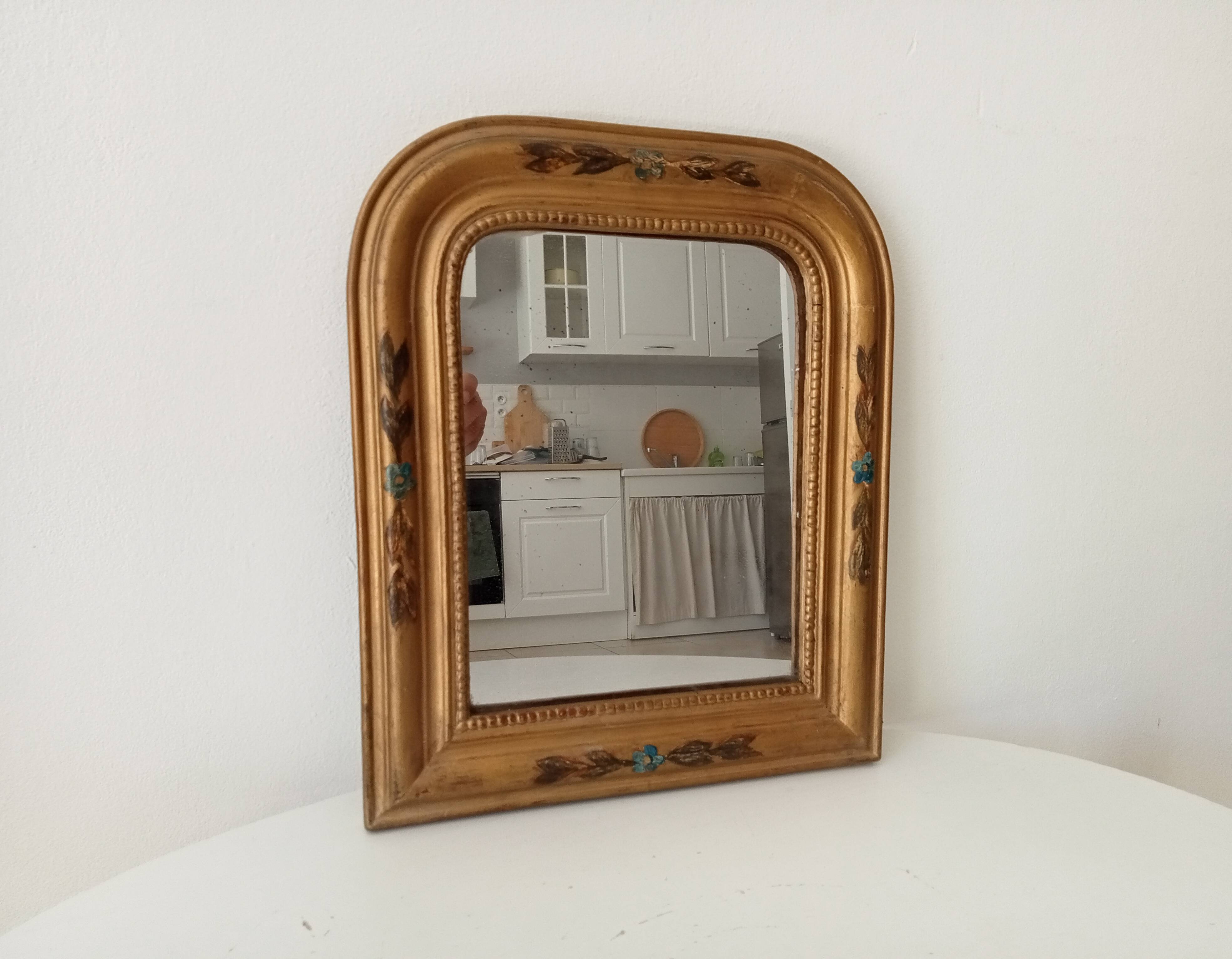 Antique Louis Philippe mirror in gilded solid wood.