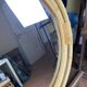 Round mirror from the 1960s with a frame made of rattan and metal.