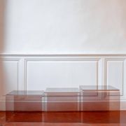 Vintage trio of nesting tables in smoked plexiglass by Michel Dumas, year.
