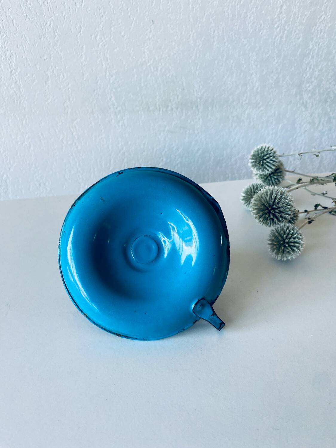 Antique enamelled metal candle holder