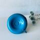Antique enamelled metal candle holder