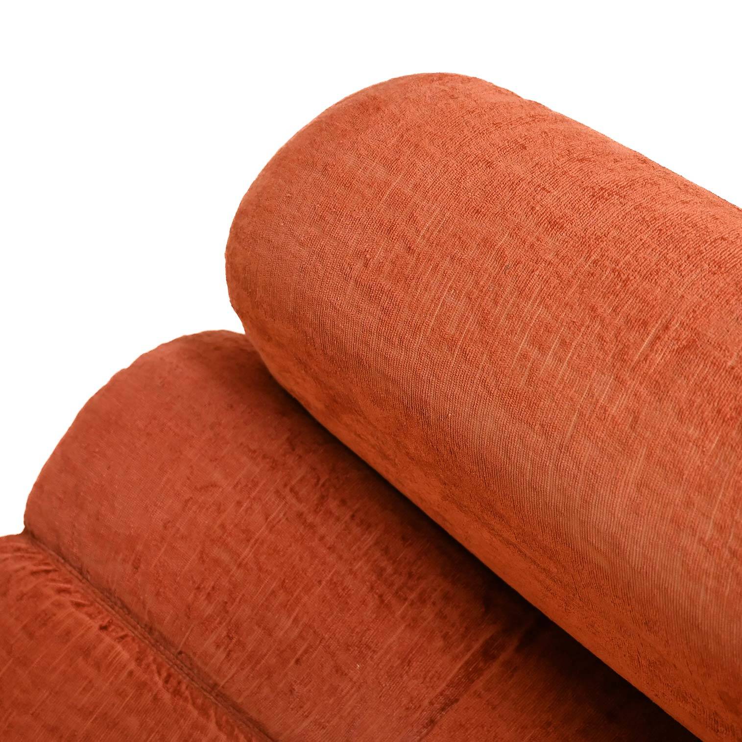 Vintage rust velvet sofa from the 1970s with metal details.