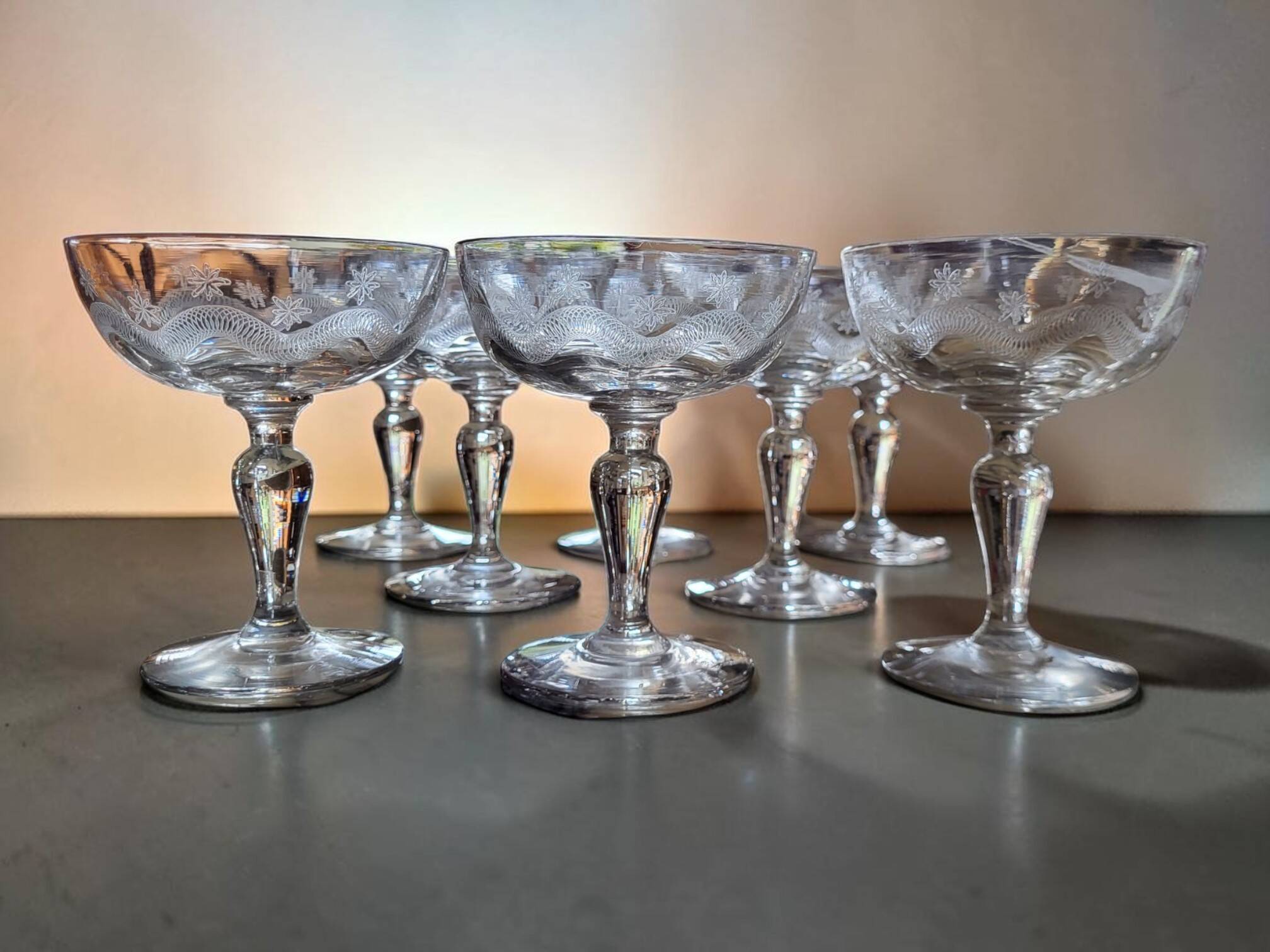 8 engraved glass champagne coupes from Meisenthal, Art Deco