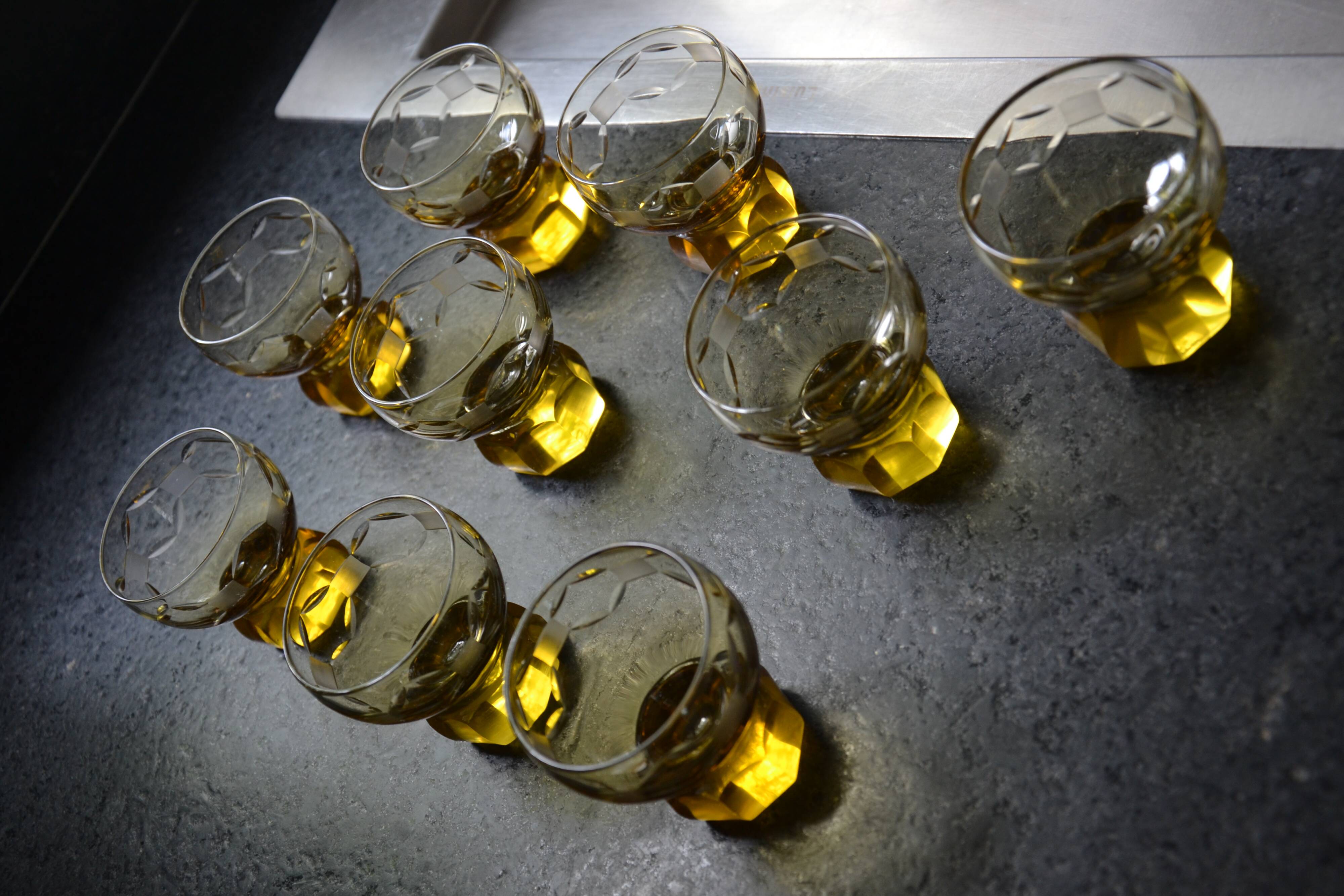 9 small amber art deco glasses
