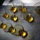 9 small amber art deco glasses