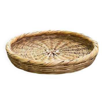 Round basket woven from straw