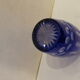 Blue and transparent glass vase, has vintage geometry patterns