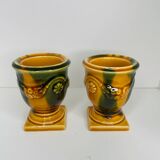 Pair of ocher and green ceramic point-a-line candlesticks
